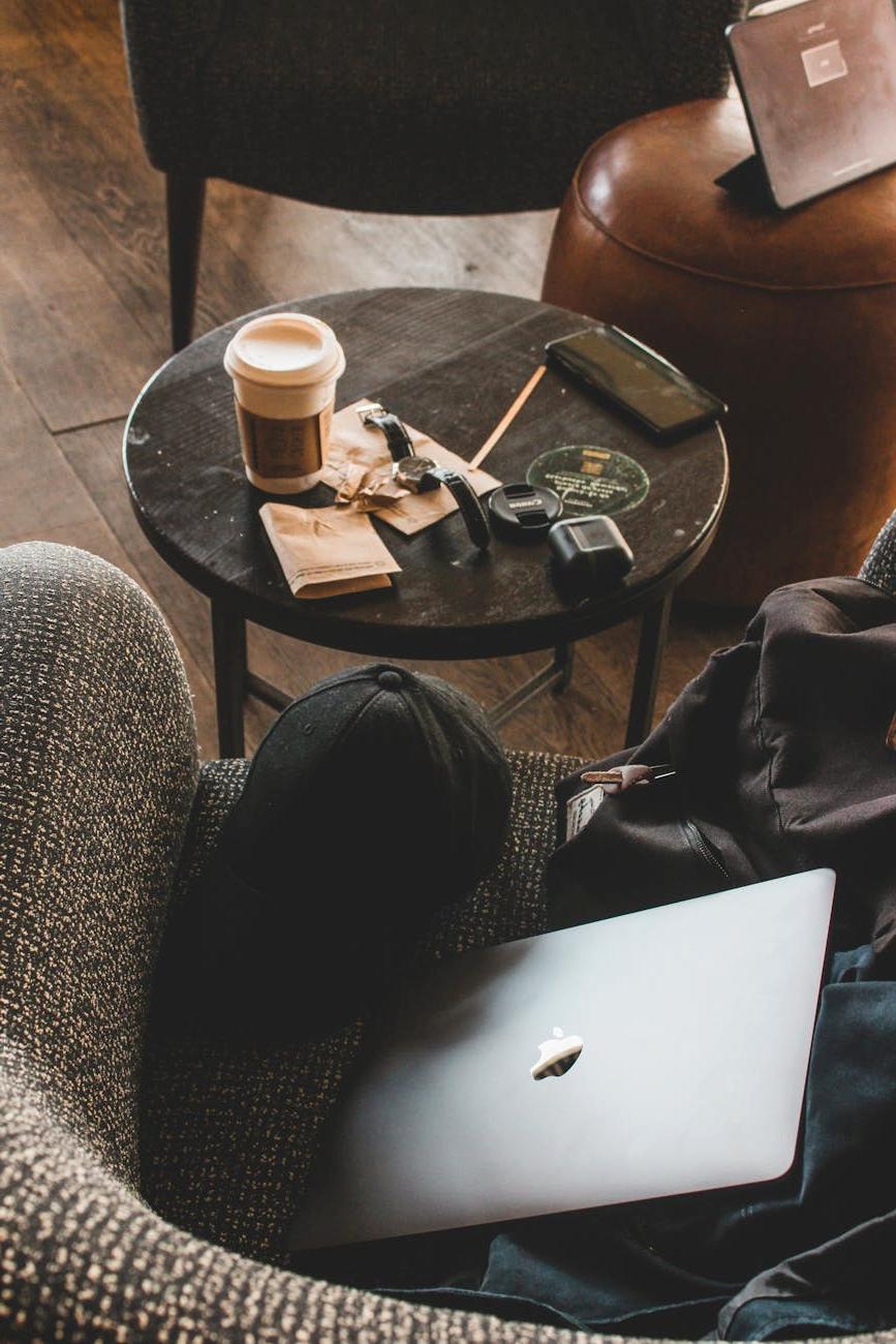 Person planning budget travel with maps and calculator